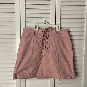 Pink laced up front mini skirt
